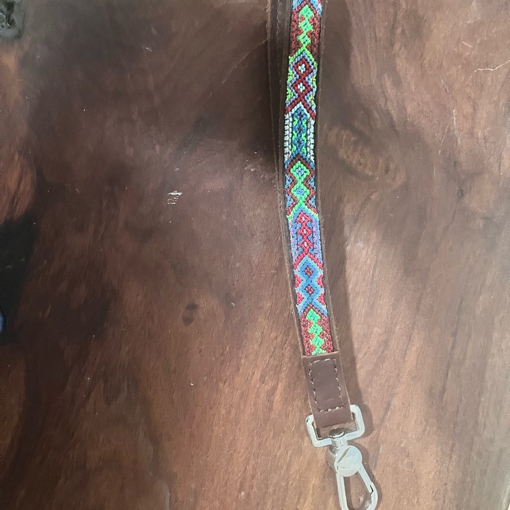Consuela leather wristlet strap. Silver hardware and beautiful stitching.
